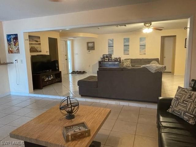 303 Georgia Ave, Fort Myers, FL 33905 - living area with light tile patterned floors, baseboards, and ceiling fan