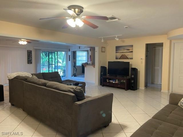 303 Georgia Ave, Fort Myers, FL 33905 - living area with a ceiling fan, light tile patterned floors, and track lighting