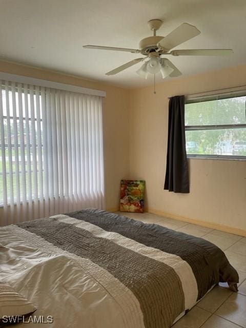 303 Georgia Ave, Fort Myers, FL 33905 - bedroom with ceiling fan and tile patterned floors