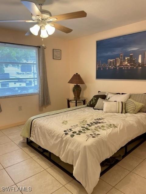 303 Georgia Ave, Fort Myers, FL 33905 - bedroom featuring light tile patterned floors, baseboards, and a ceiling fan