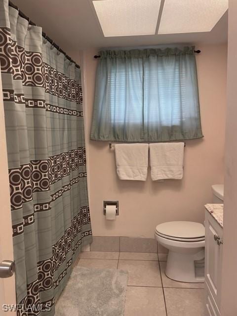 303 Georgia Ave, Fort Myers, FL 33905 - full bathroom featuring tile patterned floors, toilet, a shower with shower curtain, and vanity