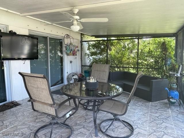 303 Georgia Ave, Fort Myers, FL 33905 - sunroom featuring outdoor dining space and a ceiling fan