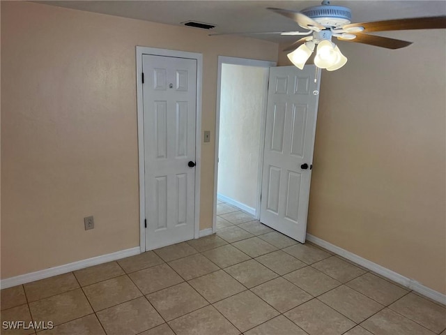 303 Georgia Ave, Fort Myers, FL 33905 - empty room featuring ceiling fan, light tile patterned flooring, baseboards, and visible vents