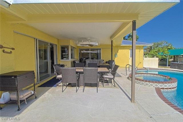 147 Coral Dr, Fort Myers, FL 33905 - view of patio with outdoor dining area, an in ground hot tub, and an outdoor pool