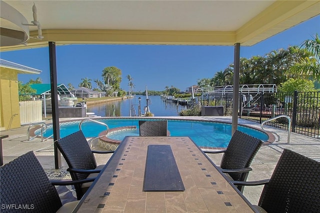 147 Coral Dr, Fort Myers, FL 33905 - view of pool with a patio area, a water view, and a fenced in pool