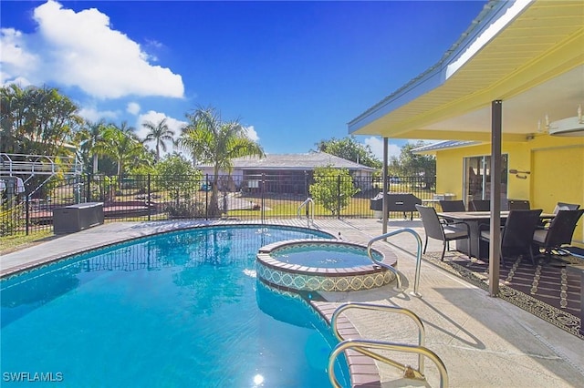 147 Coral Dr, Fort Myers, FL 33905 - view of pool featuring a pool with connected hot tub, a patio, and fence
