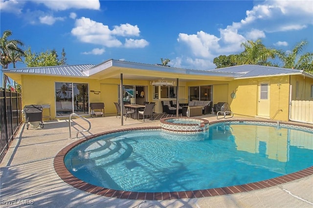 147 Coral Dr, Fort Myers, FL 33905 - rear view of house featuring an outdoor living space, a patio area, stucco siding, and metal roof