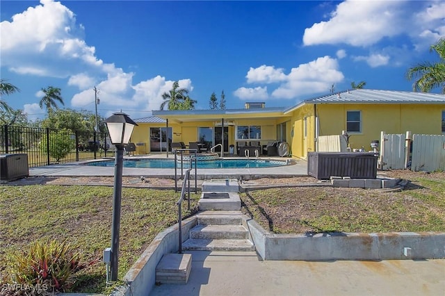 147 Coral Dr, Fort Myers, FL 33905 - back of house featuring central air condition unit, a patio, a fenced in pool, and fence