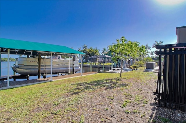 147 Coral Dr, Fort Myers, FL 33905 - view of yard featuring a water view, a boat dock, and boat lift