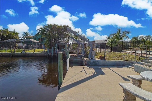 147 Coral Dr, Fort Myers, FL 33905 - view of dock featuring fence and a water view
