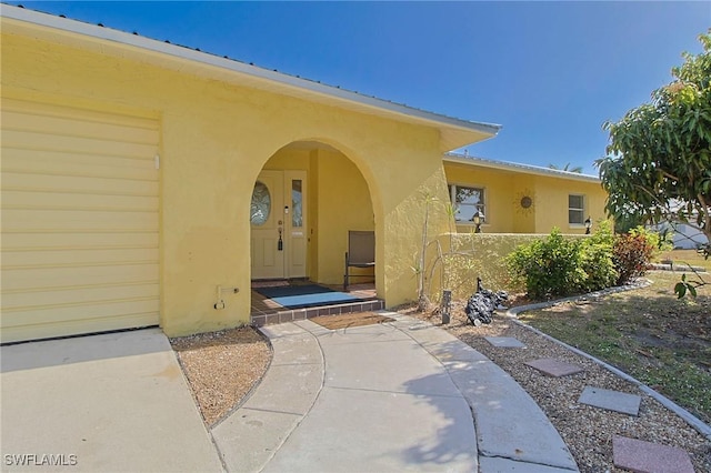 147 Coral Dr, Fort Myers, FL 33905 - view of exterior entry with stucco siding