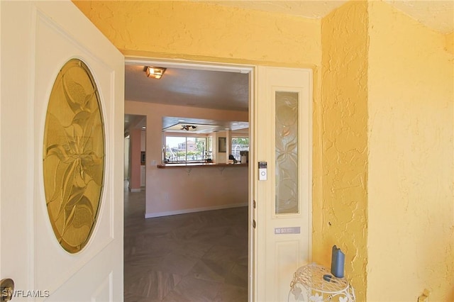 147 Coral Dr, Fort Myers, FL 33905 - hallway with baseboards and a textured wall