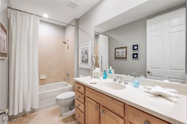 full bath with shower / bath combo, vanity, toilet, tile patterned floors, and visible vents