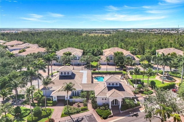 bird's eye view featuring a view of trees and a residential view
