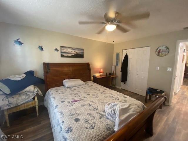 bedroom featuring a closet, a ceiling fan, and wood finished floors