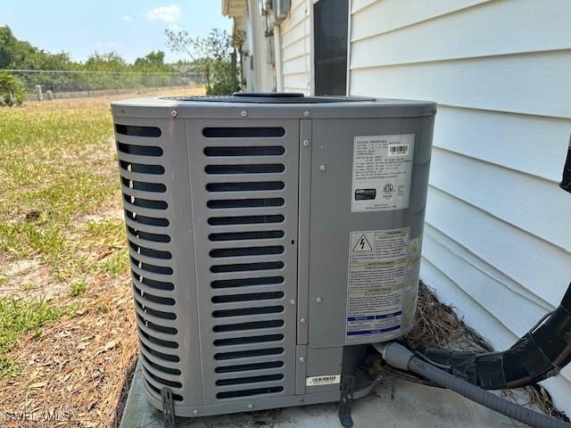 exterior details featuring fence and central AC