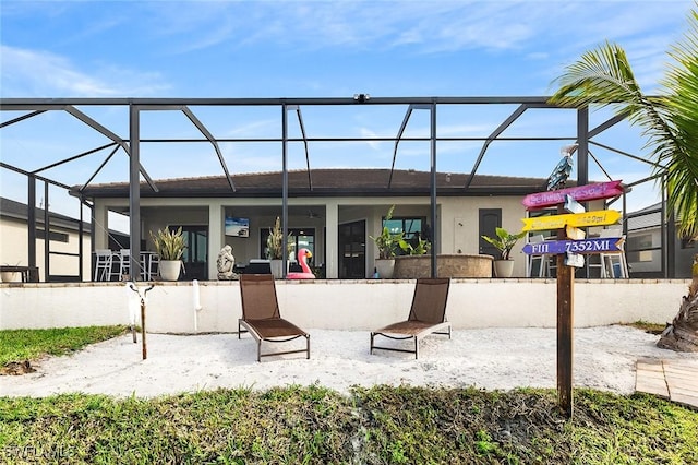 back of house featuring a lanai