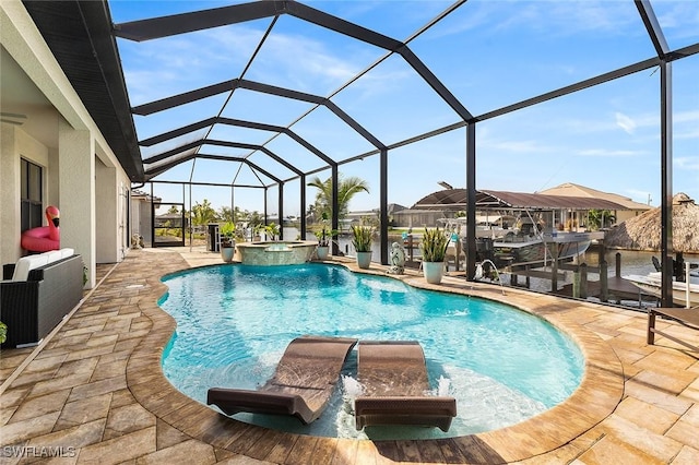 view of swimming pool featuring a boat dock, a pool with connected hot tub, glass enclosure, boat lift, and a patio