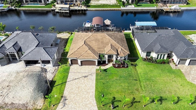 birds eye view of property featuring a water view and a residential view