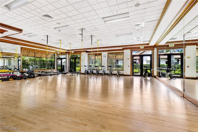 gym featuring wood finished floors and visible vents