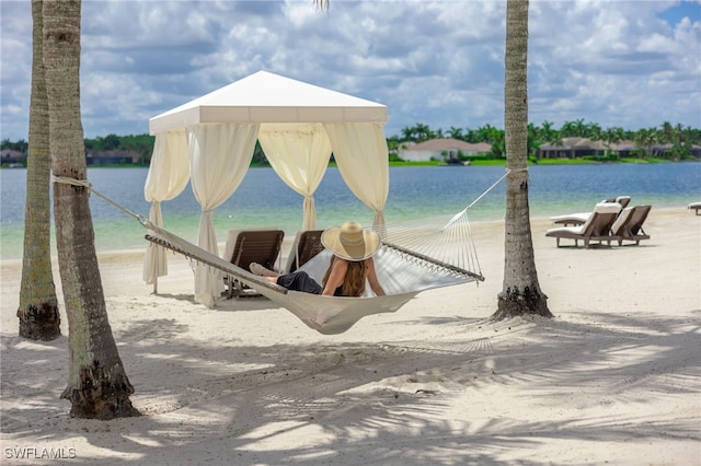 dock area with a gazebo and a water view