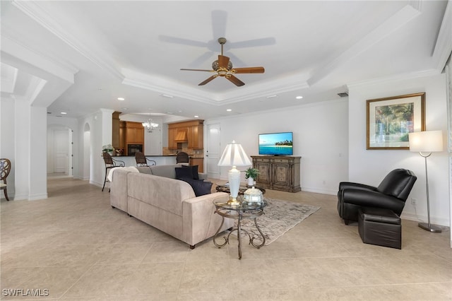 living area featuring crown molding, recessed lighting, a tray ceiling, and light tile patterned floors