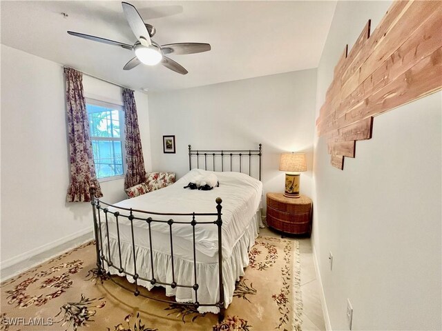 5445 Double Eagle Cir Unit 3012, Ave Maria, FL 34142 - bedroom featuring baseboards and ceiling fan