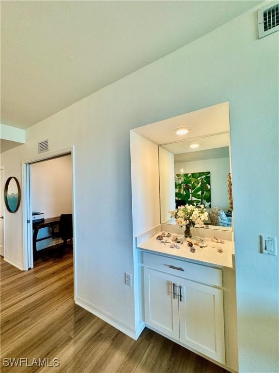 5445 Double Eagle Cir Unit 3012, Ave Maria, FL 34142 - bar area with dark wood-style floors and baseboards
