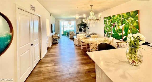 5445 Double Eagle Cir Unit 3012, Ave Maria, FL 34142 - dining area with wood finished floors and a chandelier