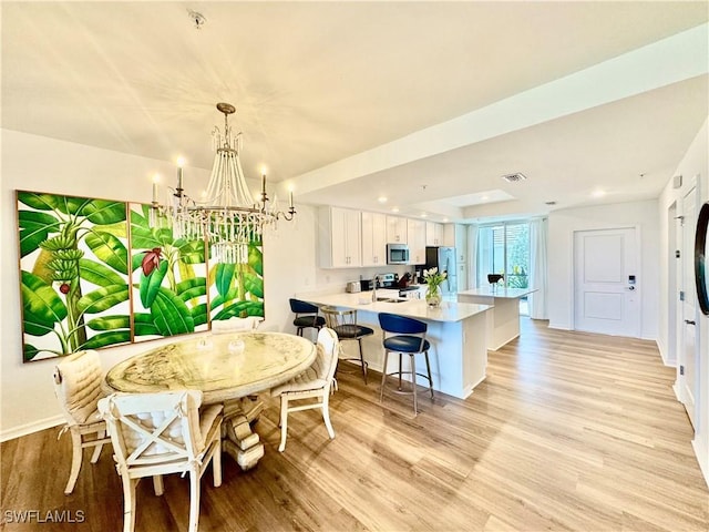 5445 Double Eagle Cir Unit 3012, Ave Maria, FL 34142 - dining area featuring a chandelier, light wood-style flooring, baseboards, and recessed lighting
