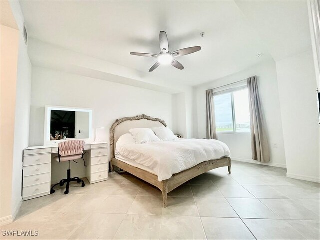 5445 Double Eagle Cir Unit 3012, Ave Maria, FL 34142 - bedroom with light tile patterned floors, an office area, a ceiling fan, and baseboards