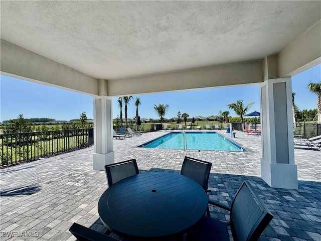 5445 Double Eagle Cir Unit 3012, Ave Maria, FL 34142 - community pool with a patio area and outdoor dining area