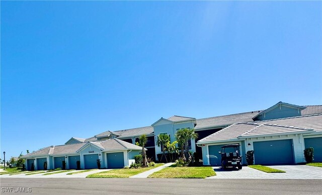 5445 Double Eagle Cir Unit 3012, Ave Maria, FL 34142 - view of front facade featuring a tiled roof