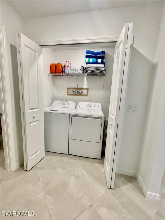 5445 Double Eagle Cir Unit 3012, Ave Maria, FL 34142 - laundry area with washing machine and clothes dryer