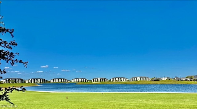 5445 Double Eagle Cir Unit 3012, Ave Maria, FL 34142 - view of property's community featuring a lawn and a water view