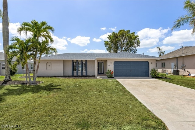 1424 SW 49th St, Cape Coral, FL 33914 - ranch-style home featuring stucco siding, driveway, a garage, and a front yard
