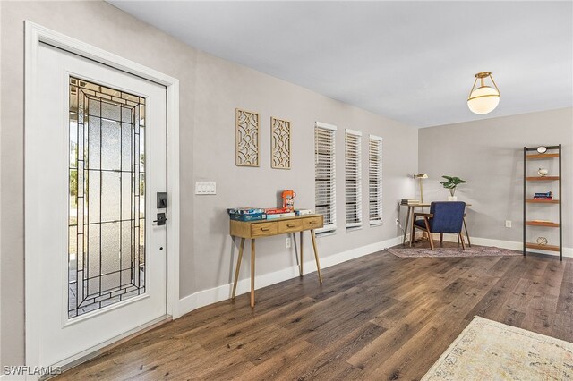 1424 SW 49th St, Cape Coral, FL 33914 - entrance foyer with wood finished floors and baseboards