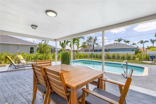 1424 SW 49th St, Cape Coral, FL 33914 - view of pool with a patio, outdoor dining area, and a fenced backyard