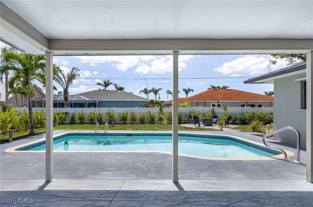 1424 SW 49th St, Cape Coral, FL 33914 - view of pool with a patio area and a fenced backyard