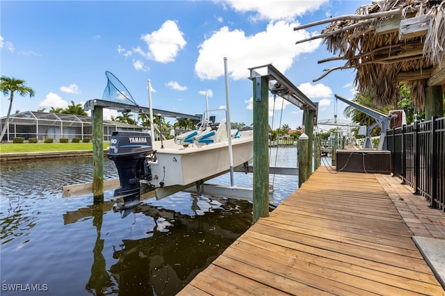 5122 Santa Rosa Ct, Cape Coral, FL 33904 - view of dock with boat lift and a water view