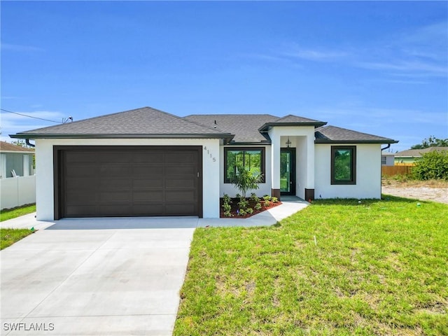 4115 20th St SW, Lehigh Acres, FL 33976 - prairie-style home with fence, an attached garage, stucco siding, a front yard, and driveway