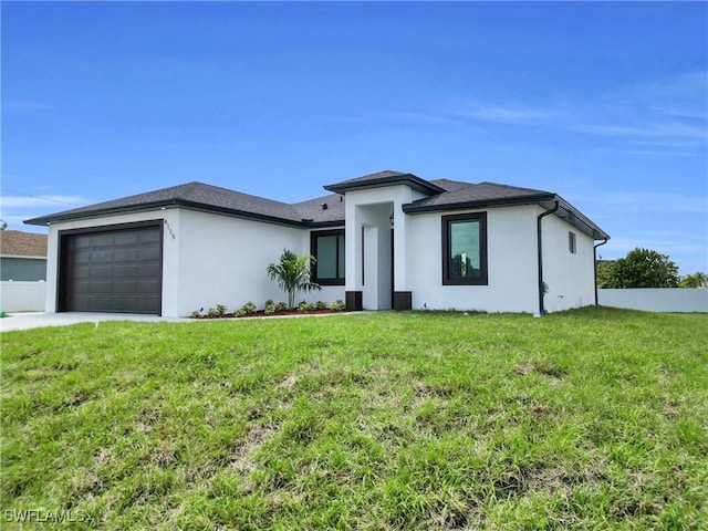 4115 20th St SW, Lehigh Acres, FL 33976 - prairie-style home featuring concrete driveway, an attached garage, a front lawn, and stucco siding