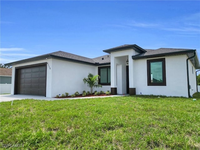4115 20th St SW, Lehigh Acres, FL 33976 - prairie-style home with an attached garage, a front yard, and stucco siding