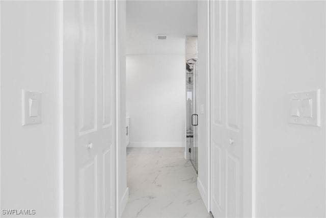 4115 20th St SW, Lehigh Acres, FL 33976 - hallway with baseboards, visible vents, and marble finish floor