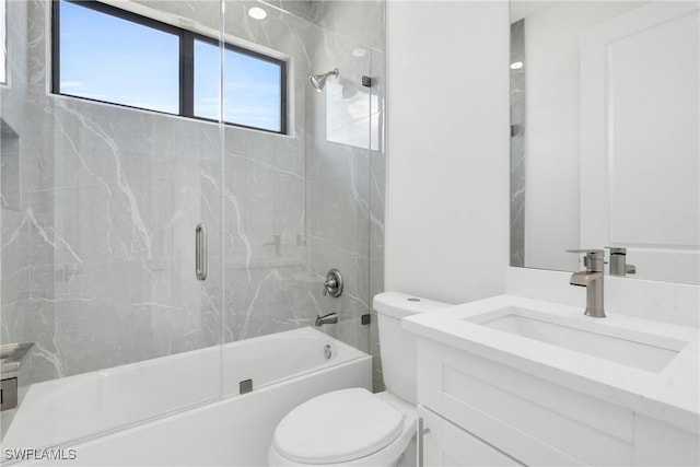 4115 20th St SW, Lehigh Acres, FL 33976 - bathroom featuring toilet, shower / bath combination with glass door, and vanity