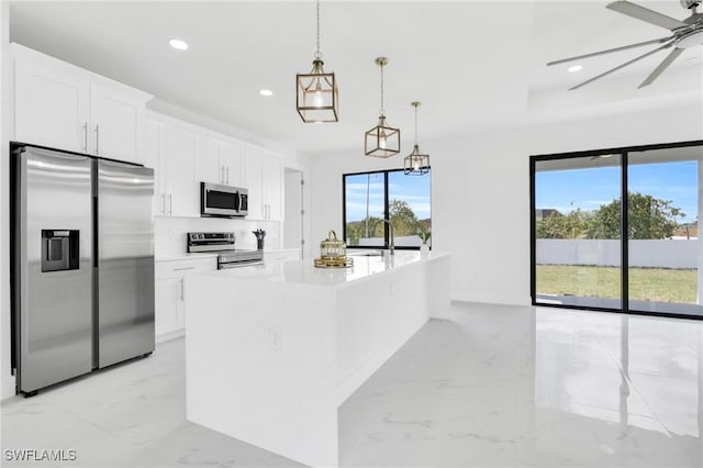 4115 20th St SW, Lehigh Acres, FL 33976 - kitchen featuring marble finish floor, recessed lighting, white cabinetry, a ceiling fan, and stainless steel appliances