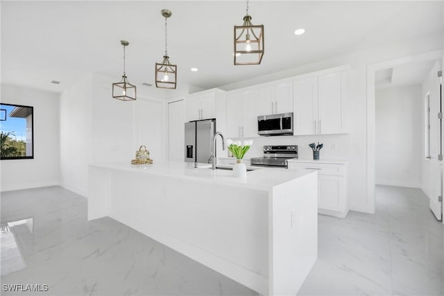 4115 20th St SW, Lehigh Acres, FL 33976 - kitchen with a sink, appliances with stainless steel finishes, white cabinetry, and marble finish floor