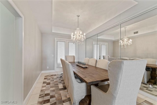 2000 Royal Marco Way Unit 607, Marco Island, FL 34145 - dining area with a chandelier, a tray ceiling, and baseboards