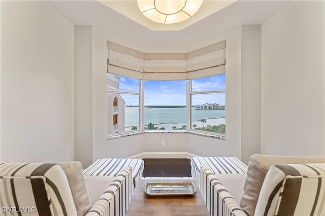 2000 Royal Marco Way Unit 607, Marco Island, FL 34145 - living area featuring wood finished floors, a water view, and baseboards