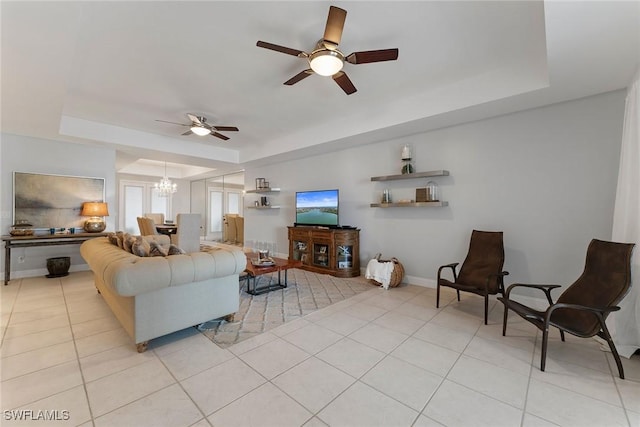 2000 Royal Marco Way Unit 607, Marco Island, FL 34145 - living area featuring a tray ceiling, ceiling fan, a chandelier, and light tile patterned floors